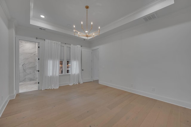 6060 Pasquo Rd, Nashville, TN 37221 - unfurnished room with light wood finished floors, a chandelier, ornamental molding, a raised ceiling, and recessed lighting