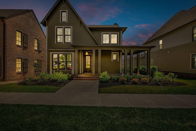 6060 Pasquo Rd, Nashville, TN 37221 - view of front of home featuring a porch, a front yard, and a chimney
