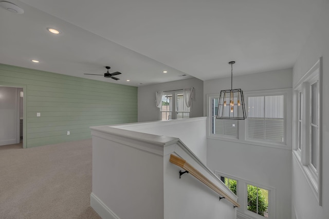 6060 Pasquo Rd, Nashville, TN 37221 - hall featuring a chandelier, an upstairs landing, recessed lighting, wood walls, and carpet flooring