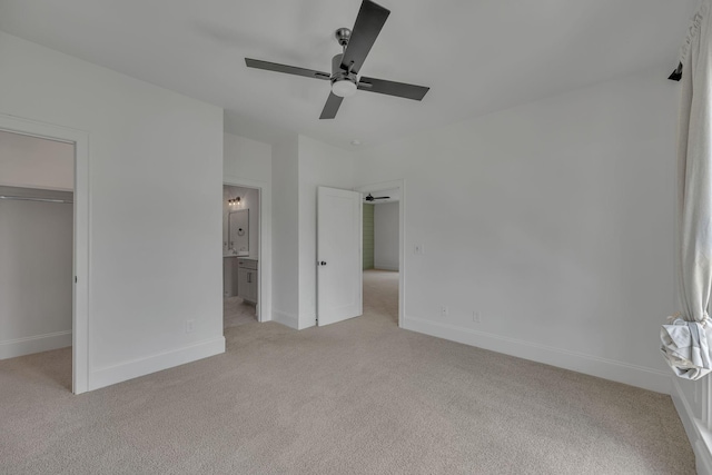 6060 Pasquo Rd, Nashville, TN 37221 - unfurnished bedroom featuring light carpet, a walk in closet, ensuite bath, a ceiling fan, and a closet