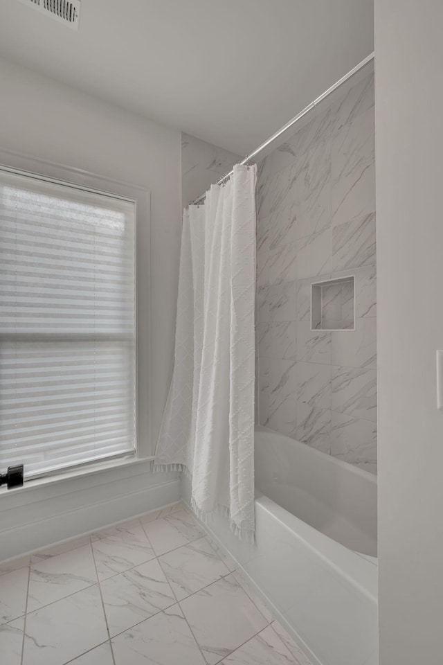 6060 Pasquo Rd, Nashville, TN 37221 - bathroom featuring marble look tile flooring and shower / bath combo with shower curtain
