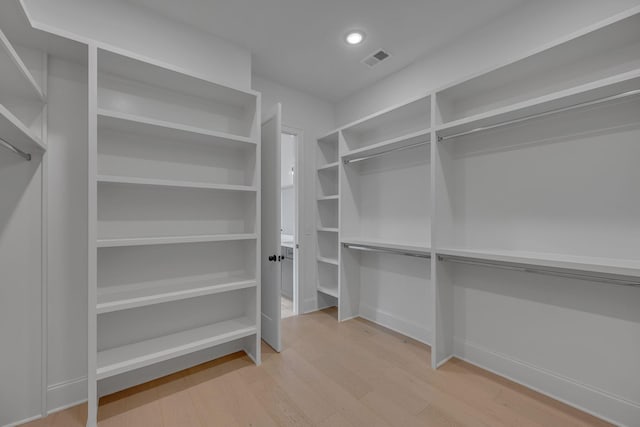 6060 Pasquo Rd, Nashville, TN 37221 - walk in closet featuring wood finished floors