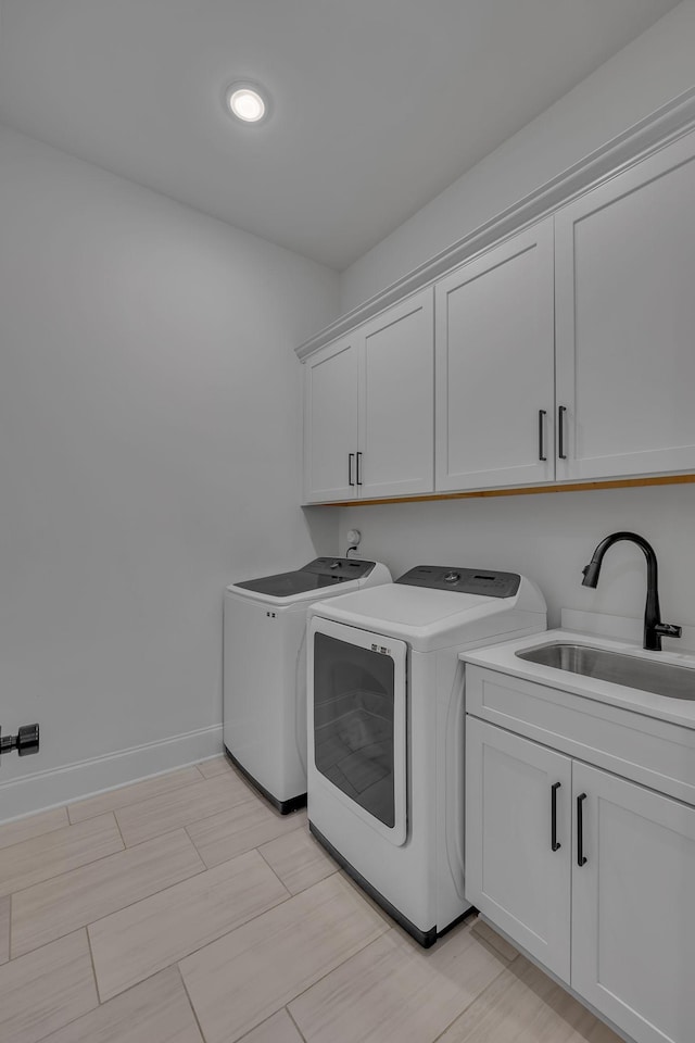 6060 Pasquo Rd, Nashville, TN 37221 - laundry area featuring separate washer and dryer and cabinet space
