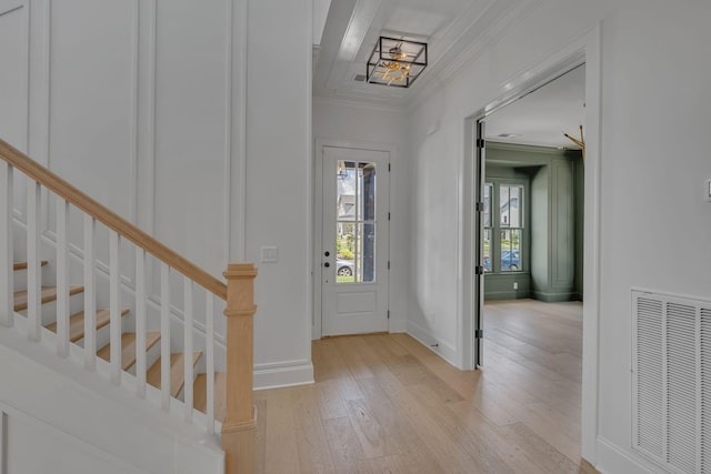 6060 Pasquo Rd, Nashville, TN 37221 - foyer entrance with light wood-style flooring, crown molding, and stairway