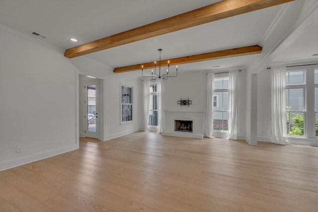 6060 Pasquo Rd, Nashville, TN 37221 - unfurnished living room featuring beam ceiling, light wood-type flooring, a chandelier, a brick fireplace, and recessed lighting