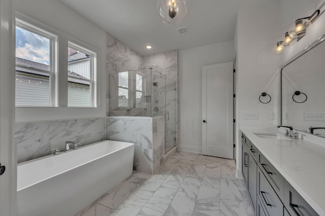 6060 Pasquo Rd, Nashville, TN 37221 - bathroom with marble finish flooring, a soaking tub, vanity, a marble finish shower, and recessed lighting
