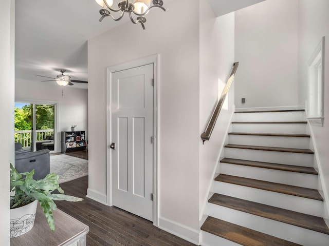7811 Lampley Rd, Primm Springs, TN 38476 - staircase featuring hardwood / wood-style floors, a chandelier, and ceiling fan
