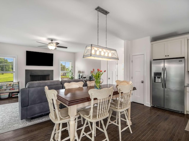 7811 Lampley Rd, Primm Springs, TN 38476 - dining room with ceiling fan, dark wood finished floors, and a fireplace
