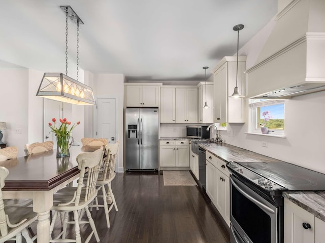 7811 Lampley Rd, Primm Springs, TN 38476 - kitchen with appliances with stainless steel finishes, custom range hood, dark wood-style floors, and white cabinets