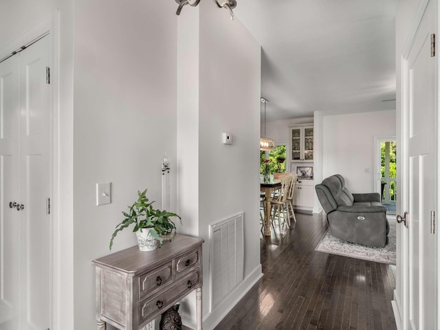 7811 Lampley Rd, Primm Springs, TN 38476 - corridor featuring dark wood-style floors and baseboards