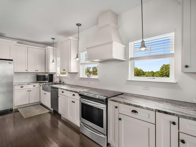 7811 Lampley Rd, Primm Springs, TN 38476 - kitchen featuring stainless steel appliances, custom range hood, white cabinetry, and dark wood-style floors