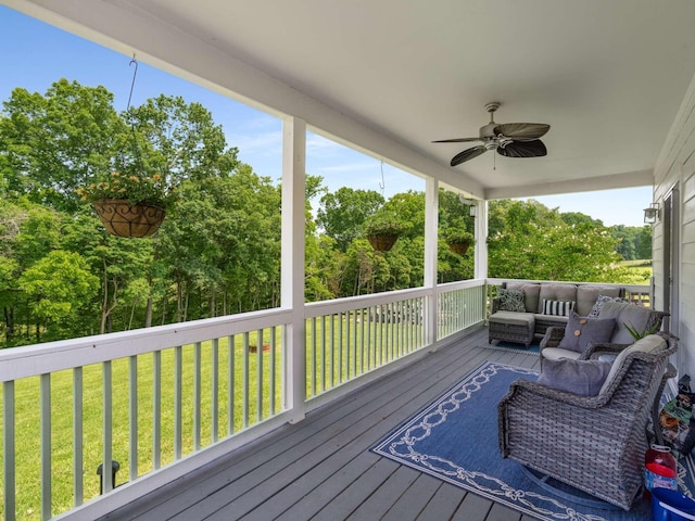 7811 Lampley Rd, Primm Springs, TN 38476 - deck featuring an outdoor hangout area, a ceiling fan, a yard, and view of wooded area