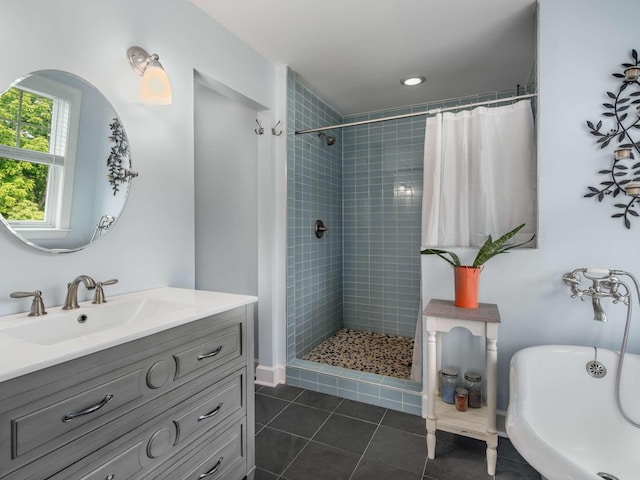 7811 Lampley Rd, Primm Springs, TN 38476 - bathroom featuring a tile shower, a freestanding bath, vanity, and tile patterned flooring