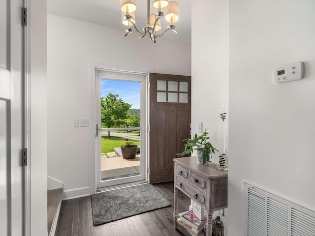 7811 Lampley Rd, Primm Springs, TN 38476 - foyer entrance featuring a chandelier and dark wood-type flooring