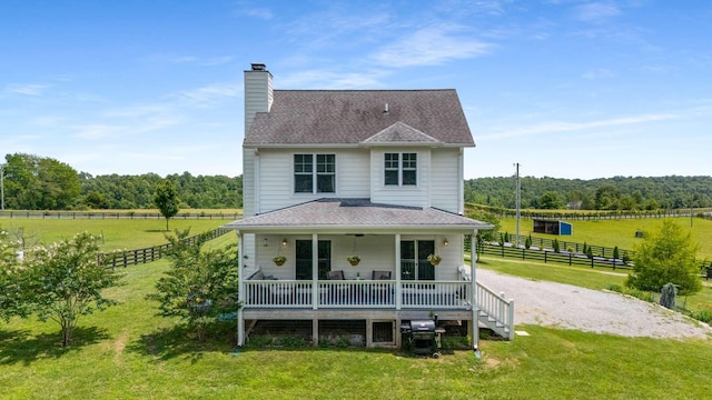 7811 Lampley Rd, Primm Springs, TN 38476 - back of property featuring a chimney, a view of countryside, roof with shingles, and a wooded view