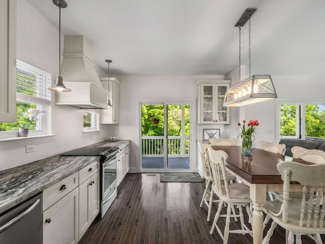7811 Lampley Rd, Primm Springs, TN 38476 - kitchen with appliances with stainless steel finishes, premium range hood, glass insert cabinets, and healthy amount of natural light