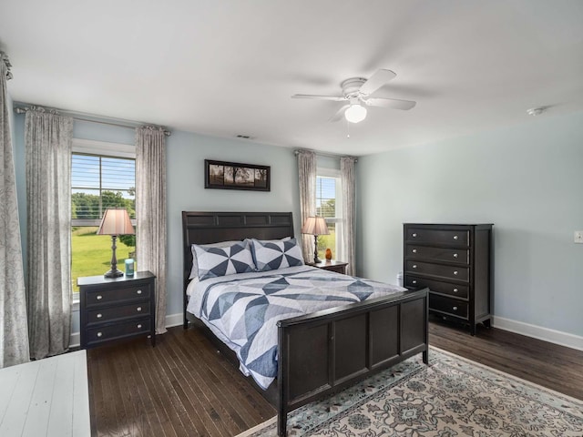 7811 Lampley Rd, Primm Springs, TN 38476 - bedroom with hardwood / wood-style flooring, multiple windows, and ceiling fan