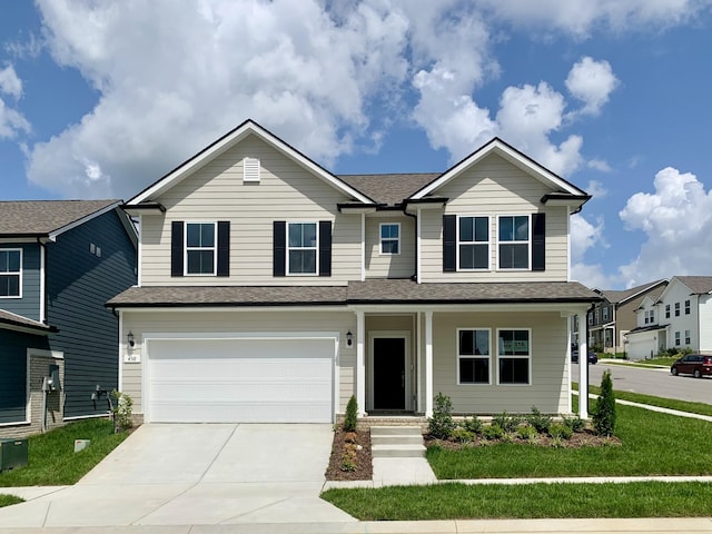 458 Jet Stream Dr, La Vergne, TN 37086 - view of front of house with driveway, a garage, a front lawn, roof with shingles, and a porch