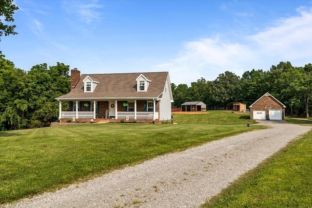 5455 Bales Rd, Cunningham, TN 37052 - cape cod-style house featuring covered porch, a chimney, an outdoor structure, a garage, and a front yard
