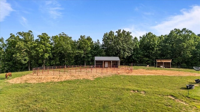 5455 Bales Rd, Cunningham, TN 37052 - view of yard featuring an exterior structure, an outbuilding, and a view of rural / pastoral area