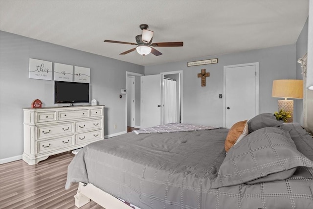 5455 Bales Rd, Cunningham, TN 37052 - bedroom with wood finished floors and ceiling fan