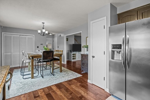 5455 Bales Rd, Cunningham, TN 37052 - dining area featuring a chandelier and dark wood finished floors