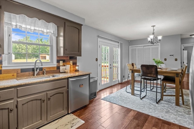 5455 Bales Rd, Cunningham, TN 37052 - kitchen with stainless steel dishwasher, a chandelier, dark wood-style floors, french doors, and decorative light fixtures