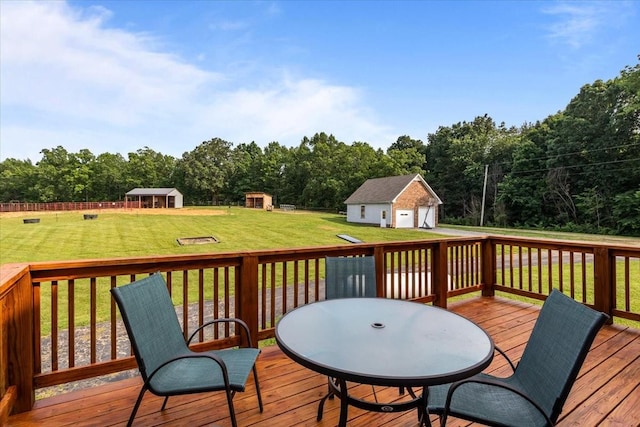 5455 Bales Rd, Cunningham, TN 37052 - wooden terrace featuring an outbuilding, a yard, outdoor dining space, and a garage