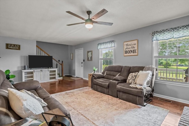 5455 Bales Rd, Cunningham, TN 37052 - living room with ceiling fan, wood finished floors, and stairs