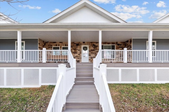 1697 Curtis Chapel Rd, Mc Ewen, TN 37101 - view of front of house featuring covered porch and stone siding