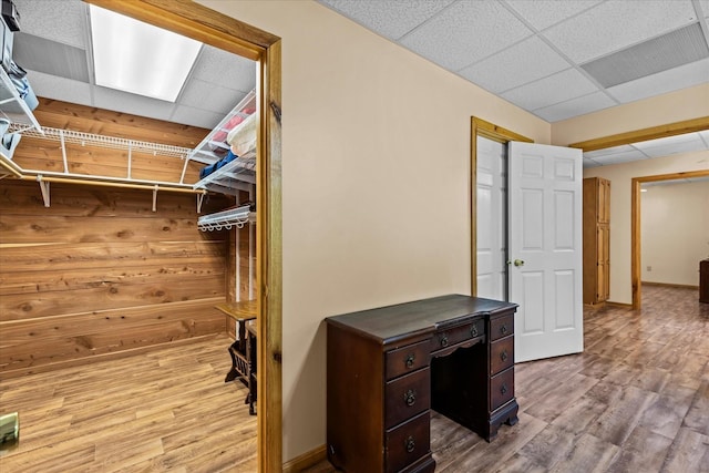 1697 Curtis Chapel Rd, Mc Ewen, TN 37101 - walk in closet with a drop ceiling and wood finished floors