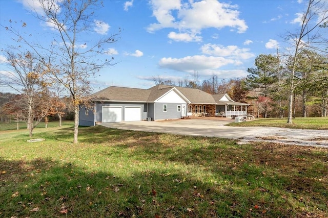1697 Curtis Chapel Rd, Mc Ewen, TN 37101 - view of front of home featuring a front lawn, concrete driveway, and an attached garage