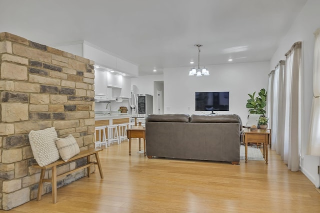 1697 Curtis Chapel Rd, Mc Ewen, TN 37101 - living area with light wood-style flooring, a chandelier, and recessed lighting