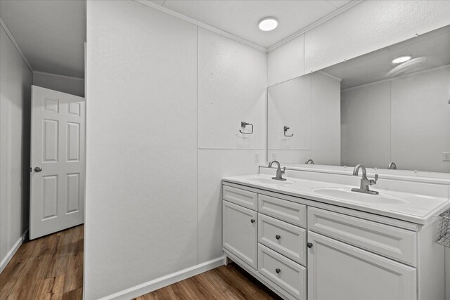 1697 Curtis Chapel Rd, Mc Ewen, TN 37101 - bathroom featuring wood finished floors, double vanity, and crown molding