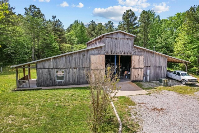1697 Curtis Chapel Rd, Mc Ewen, TN 37101 - view of outdoor structure featuring a wooded view