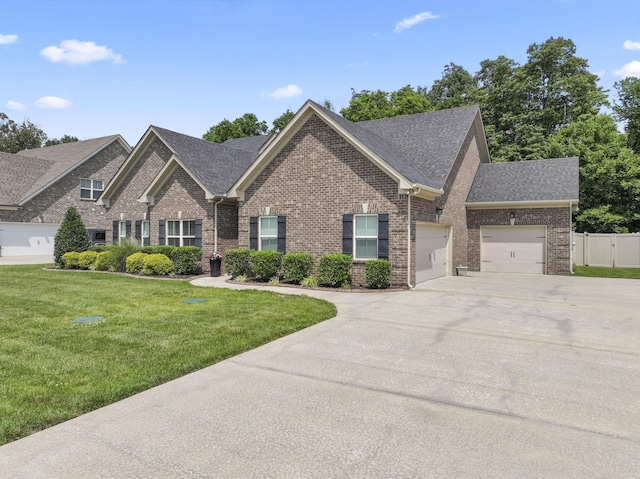 239 Mcclaran Pl, Murfreesboro, TN 37129 - view of front of house with brick siding, concrete driveway, and a shingled roof