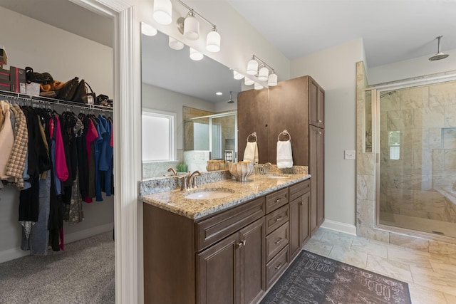 239 Mcclaran Pl, Murfreesboro, TN 37129 - bathroom with a stall shower, double vanity, and a walk in closet