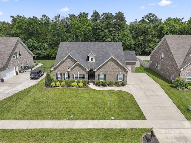 239 Mcclaran Pl, Murfreesboro, TN 37129 - view of front facade featuring driveway, brick siding, and a front yard