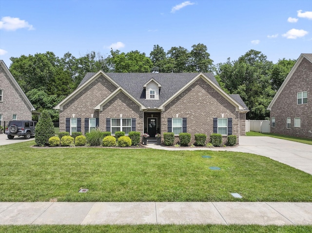 239 Mcclaran Pl, Murfreesboro, TN 37129 - view of front facade with brick siding, a front yard, and roof with shingles