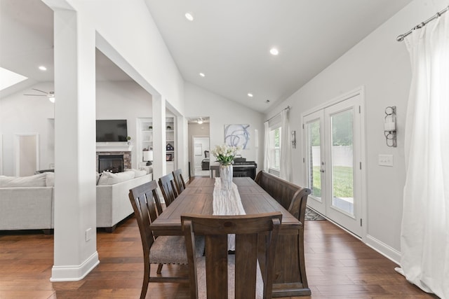 239 Mcclaran Pl, Murfreesboro, TN 37129 - dining space featuring lofted ceiling, a ceiling fan, built in shelves, a stone fireplace, and dark wood-style flooring
