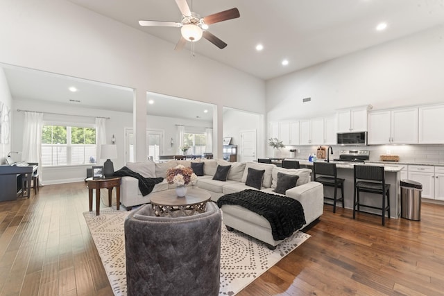 239 Mcclaran Pl, Murfreesboro, TN 37129 - living area with high vaulted ceiling, a ceiling fan, dark wood-type flooring, and recessed lighting