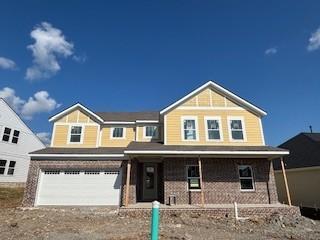 516 Little Penny Dr, Smyrna, TN 37167 - view of front facade with covered porch, a garage, and driveway