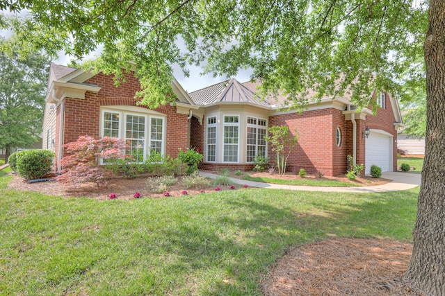 507 Bugler Rd, Mount Juliet, TN 37122 - view of front of home with brick siding, a front yard, and a garage