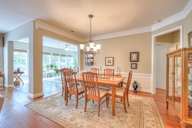 507 Bugler Rd, Mount Juliet, TN 37122 - dining space with crown molding, light wood finished floors, a chandelier, and a ceiling fan