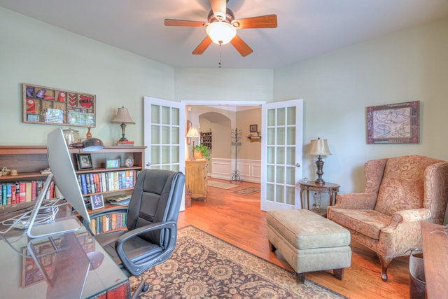 507 Bugler Rd, Mount Juliet, TN 37122 - office featuring french doors, wood finished floors, a ceiling fan, arched walkways, and a wainscoted wall