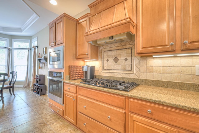 507 Bugler Rd, Mount Juliet, TN 37122 - kitchen with appliances with stainless steel finishes, custom range hood, backsplash, a raised ceiling, and recessed lighting