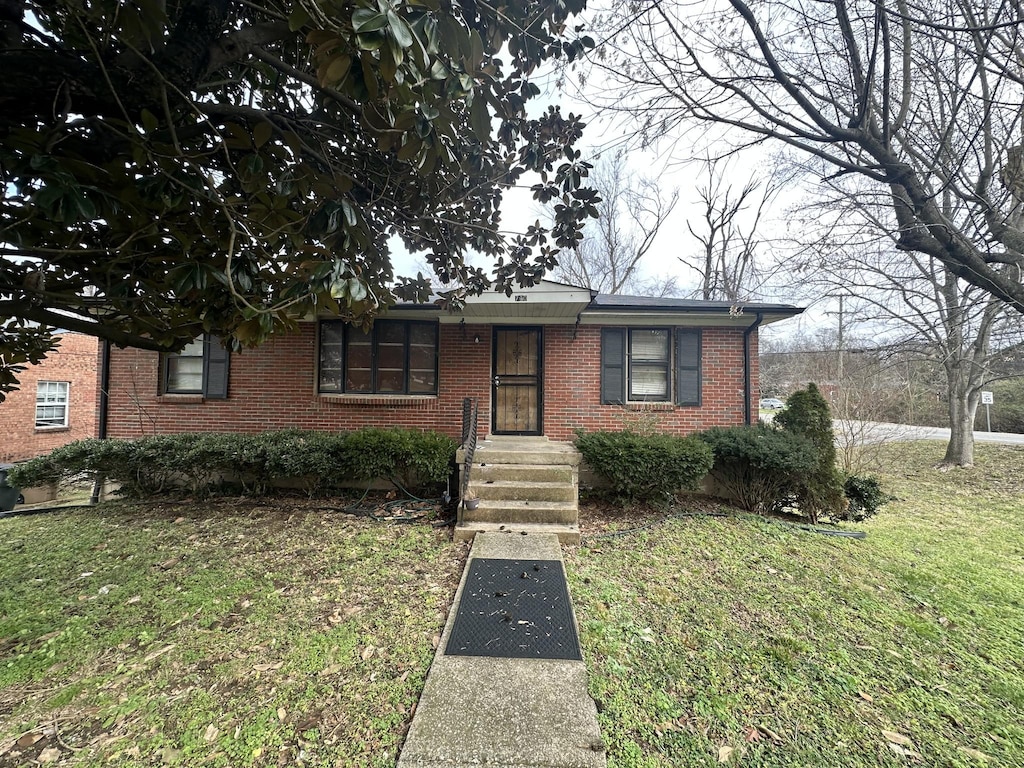 730 Patricia Dr, Nashville, TN 37217 - view of front facade featuring brick siding and a front lawn
