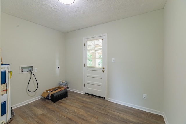 524 Inver Ln, Clarksville, TN 37042 - laundry area with hookup for an electric dryer, water heater, dark wood finished floors, hookup for a washing machine, and a textured ceiling