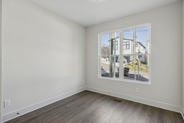 1734B Kellow St, Nashville, TN 37208 - spare room featuring baseboards and dark wood-style floors