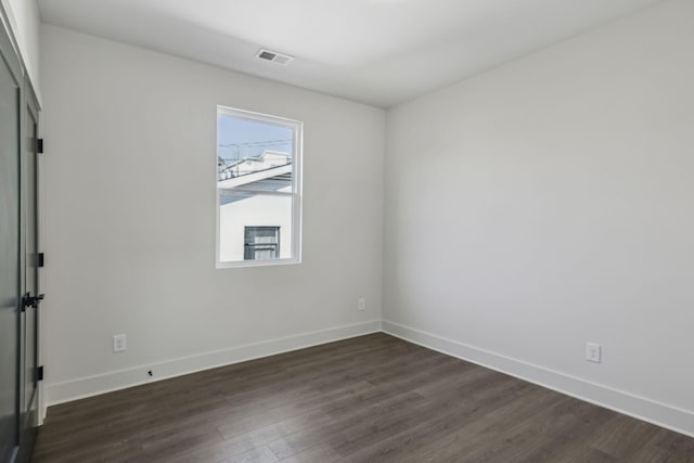 1734B Kellow St, Nashville, TN 37208 - unfurnished room featuring dark wood finished floors and baseboards